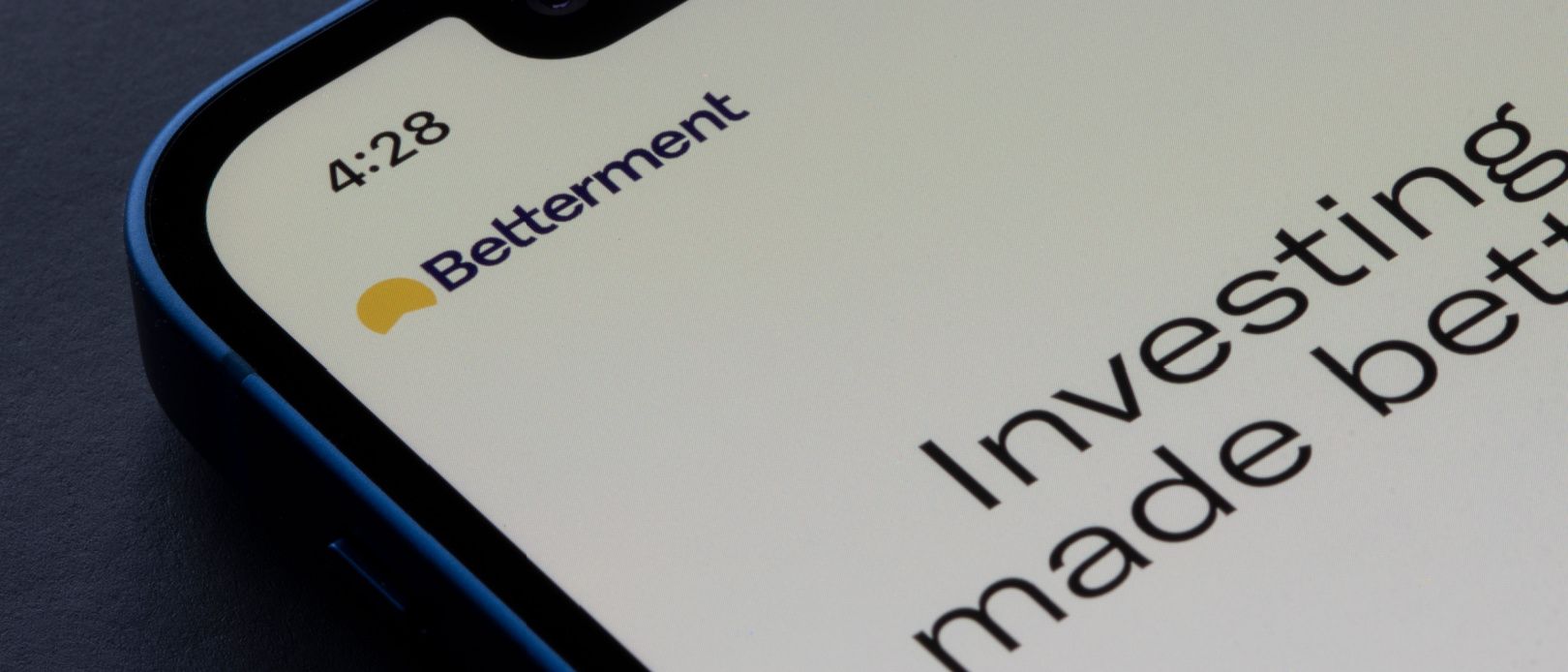 Closeup of Betterment logo seen on its app login page on an iPhone. Betterment is a financial advisory company providing robo-advising and cash management