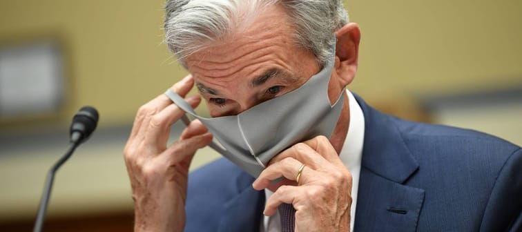 Federal Reserve Chair Jerome H. Powell removes his face mask at a U.S. House hearing on Sept. 23, 2020.