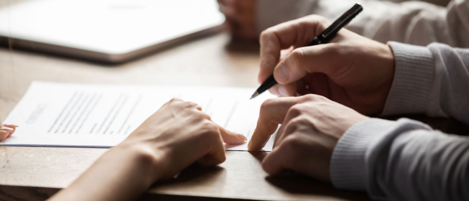 Signing a personal loan document